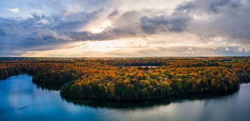 Fototapeta na wymiar Pretty autumn sunset over Pete’s Lake Campground in the Hiawatha National Forest – Michigan Upper Peninsula – aerial view