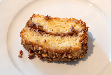 Coffee cake slice on a white dinner plate - close up