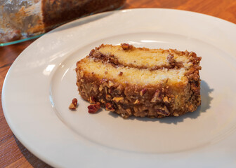 A slice of coffee cake on a white plate