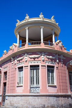 Image displaying typical Caribbean architecture with blue sky