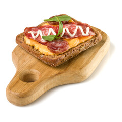 Open  faced sausage sandwich canape or crostini on a wooden serving board  isolated on white background closeup.