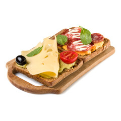 Open  faced sandwich canape or crostini on a wooden serving board  isolated on white background closeup.
