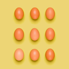 Eggs pattern on yellow background. Easter concept. Flat lay, top view. Food background.