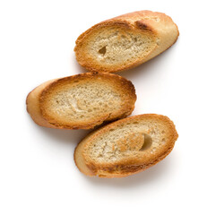 Toasted baguette slices isolated on white background close up.  Toast, crouton.   Top view.