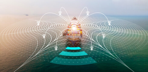 Aerial of cargo ship with WIFI Line technology connection carrying container and running for export...
