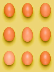 Eggs pattern on yellow background. Easter concept. Flat lay, top view. Food background.