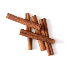 Cinnamon sticks isolated on white background closeup. Canella spice. Aromatic condiment background. Flat lay, top view.