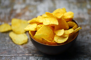 Cheese chips in a bowl. Yellow cheese chips.