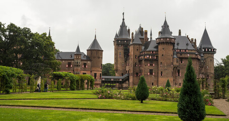 Looking at Castle De Haar across the castle grounds on an overcast, rainy day in the Netherlands, a small panorama.
