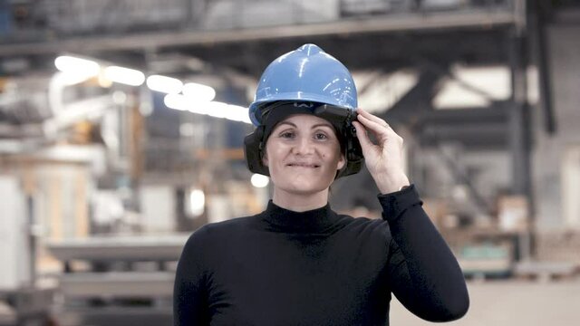 smiling woman wearing industrial augmented reality goggle device