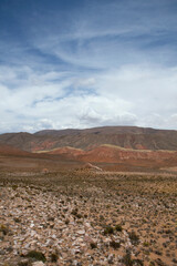 Arid desert background. The colorful canyon, arid valley, sandstone and rocky mountains under a beautiful sky.