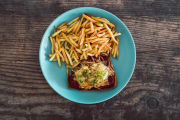 healthy plant-based food, vegan parma with plant-based schnitzel topped with tomato sauce and dairy-free cheese served with a side of chips