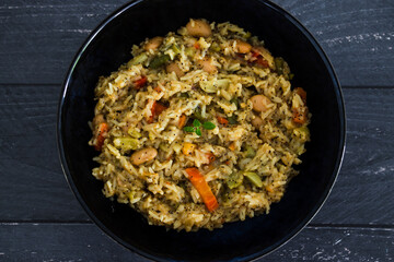 healthy plant-based food, vegan turmeric risotto with butter beans carrrots bell pepper and green beans