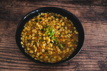 healthy plant-based food, vegan pasta in broth with lentils and vegetables