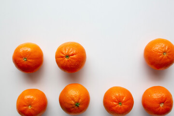 small oranges with one missing in a row
