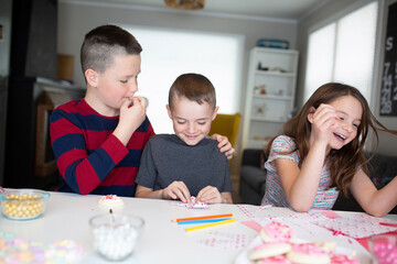 kids writing valentine's day cards