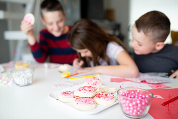 Obraz na płótnie Canvas kids writing valentine's day cards