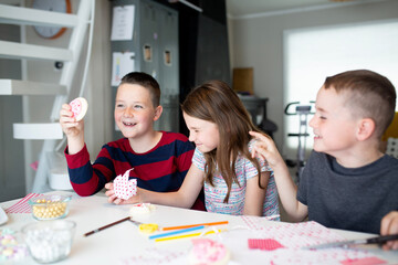 kids writing valentine's day cards