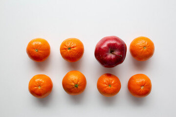 small oranges and one apple