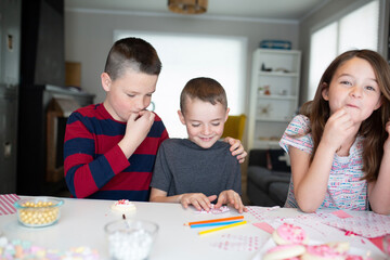 kids writing valentine's day cards