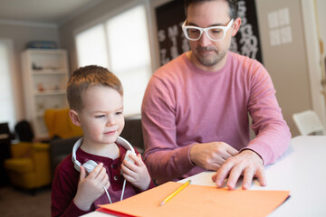 dad and son on a computer
