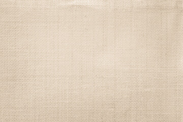 Jute hessian sackcloth canvas woven texture pattern background in light beige cream brown color blank empty