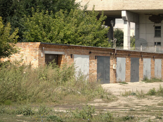 Brick garages with metal gates of a garage cooperative. Ust-Kamenogorsk (kakakhstan)