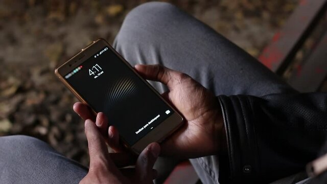 Man checking the time on his smarth phone