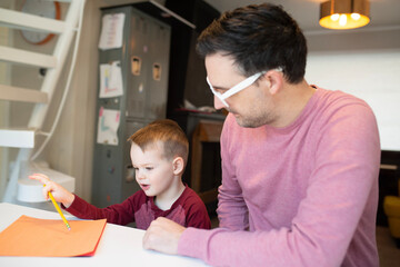 dad and son on a computer