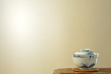 picture rice bowl. put on a floating shelf. wall is bright. This is a very fine example of Japanese traditional. lay out vintage ceramic “ imari ware ”. blurred background with copy space.