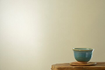 tea bowl.  put on a floating shelf. wall is bright.   This is a very fine example of Japanese traditional.  lay out  vintage ceramic “ hagi ware ”.  blurred background with copy space.