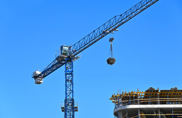 Crane and highrise construction site