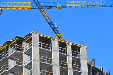 Crane and highrise construction site