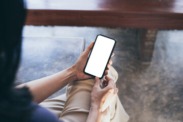 cell phone blank white screen mockup.woman hand holding texting using mobile on desk at office.background empty space for advertise.work people contact marketing business,technology