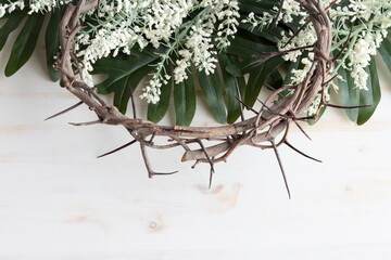crown of thorns and green palm leaves