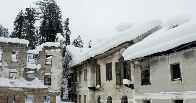 San Candido Wildbad Innchen hotel ruins in snow, South Tyrol, Italy