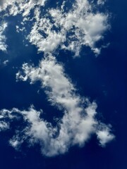 cloud in the shape of the letter S in the sky