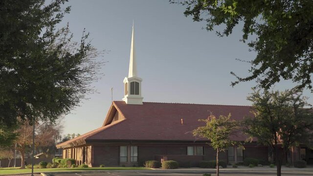 Mormon Church of Latter Day Saints Building through Tree Branches with Slow Zoom In (Wide Angle Exterior 4K)