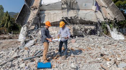 Demolition control supervisor and contractor discussing on demolish building.