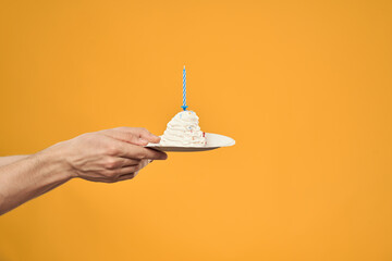 cake with candle celebration birthday decoration yellow background