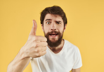 man in a t-shirt positive gesture with his hands white t-shirt bushy beard