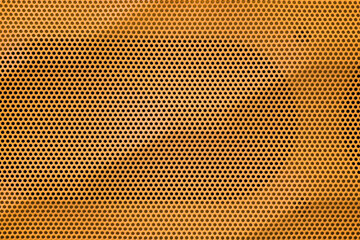 Yellow perforated steel plate texture for background