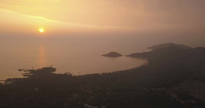 Misty sunset over the beautiful South Goa, India shoreline -aerial