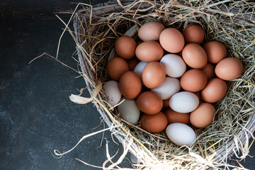 Duck eggs and Chicken eggs. on the hey.Fresh Chicken Rooster Eggs on Hay at Local Farmer Market