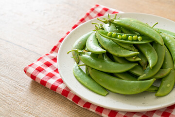 fresh sweet green peas on plate