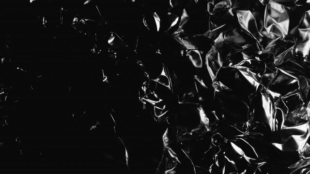 Reflection Of Light On Crumpled Tinfoil, Aluminium Foil. - close up