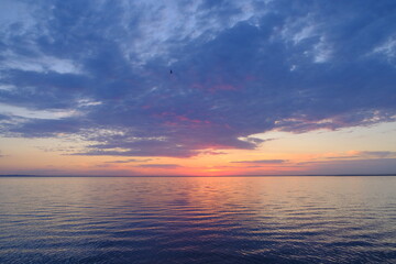 Naklejka na ściany i meble beautiful sunset on the lake in the summer