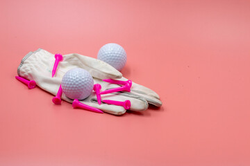 Tennis ball and pink tee are on pink background 