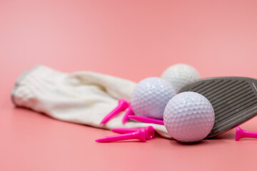 Golf ball and tee are on pinkbackground
