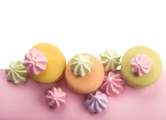 Obraz na płótnie Canvas Dessert cake macaron or macaroon on pink background top view. Flat lay composition.
